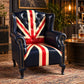 The Britannia Union Jack Chesterfield wingback armchair in genuine buffalo leather, featuring a hand-painted British flag, deep button tufting and brass studs.
