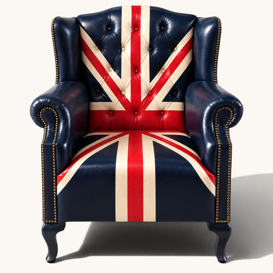 The Britannia Union Jack Chesterfield wingback armchair in genuine buffalo leather, featuring a hand-painted British flag, deep button tufting and brass studs.
